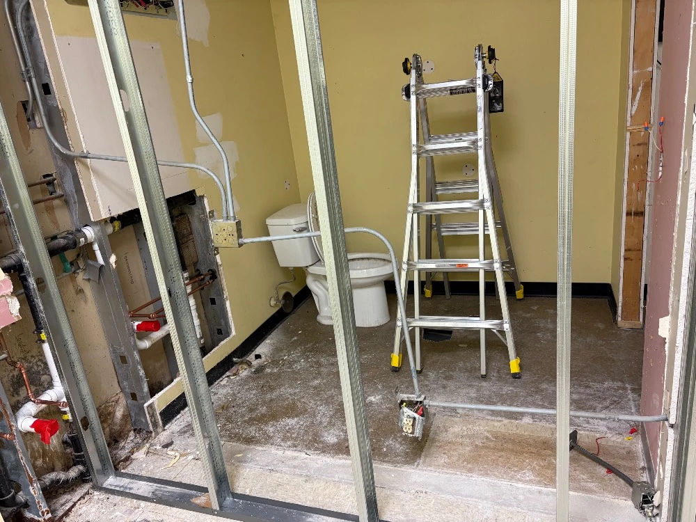 Bathroom under renovation with new electrical work in progress